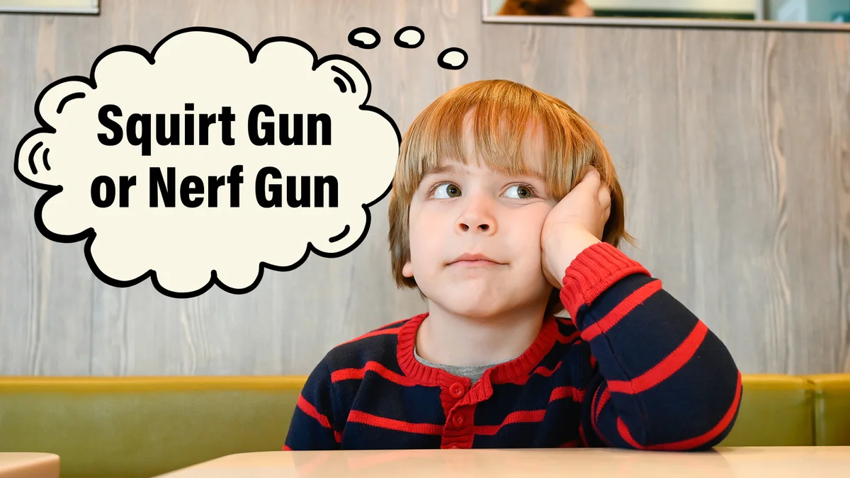 Boy thinking about squirt gun or nerf gun