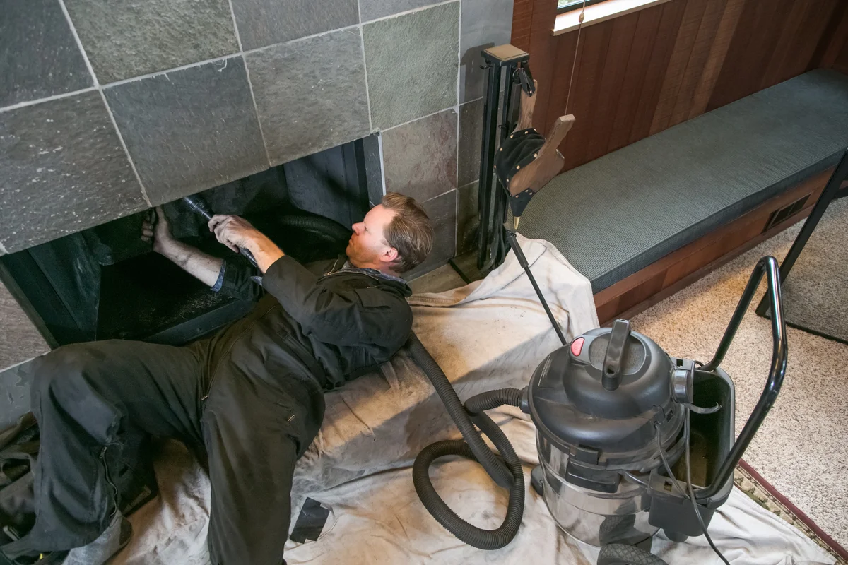Chimney sweep cleaning chimney