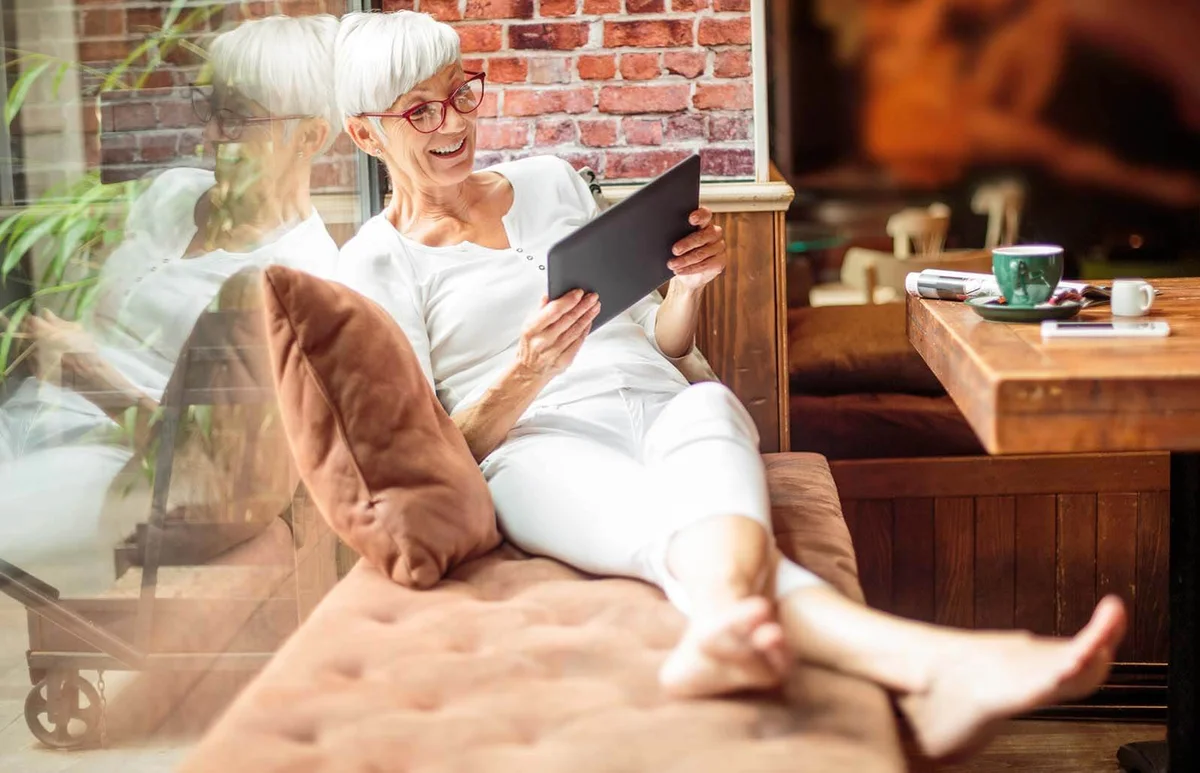 Senior woman with digital tablet