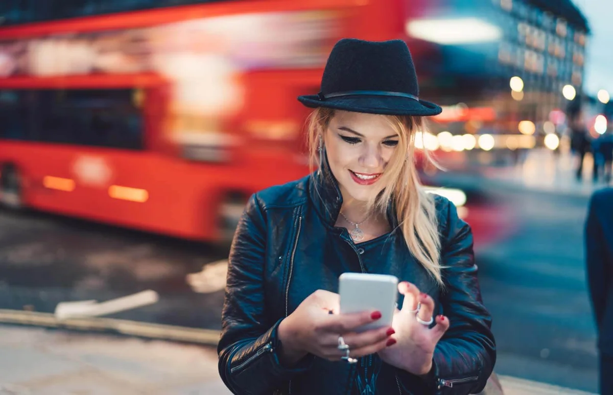 woman text messaging at the street