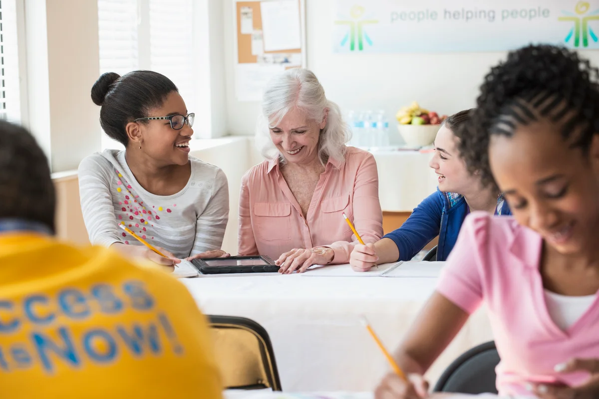 Tutoring students in classroom
