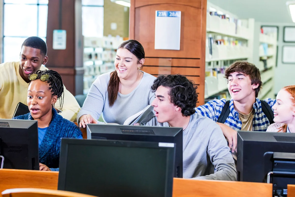 Students in library on computers together