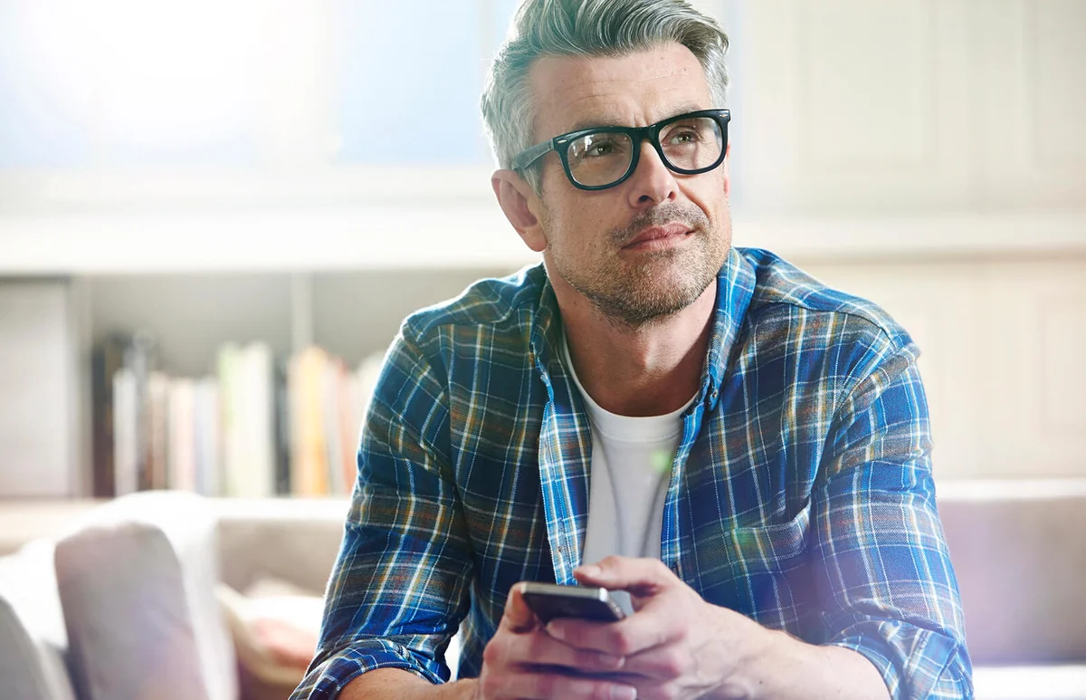 Thoughtful man relaxing at home