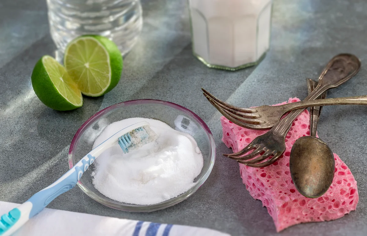 Baking soda, lemon with sponge and towel for effective and safe house cleaning