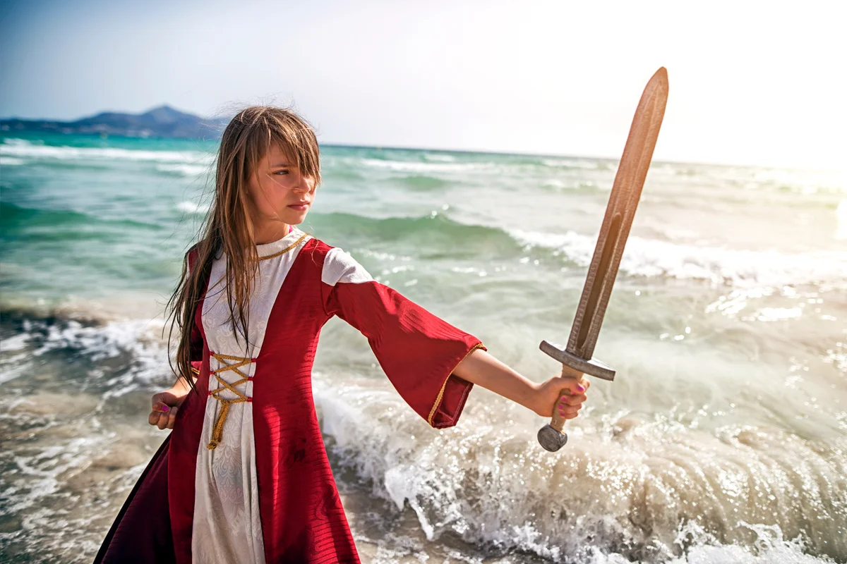 Young viking practicing with sword