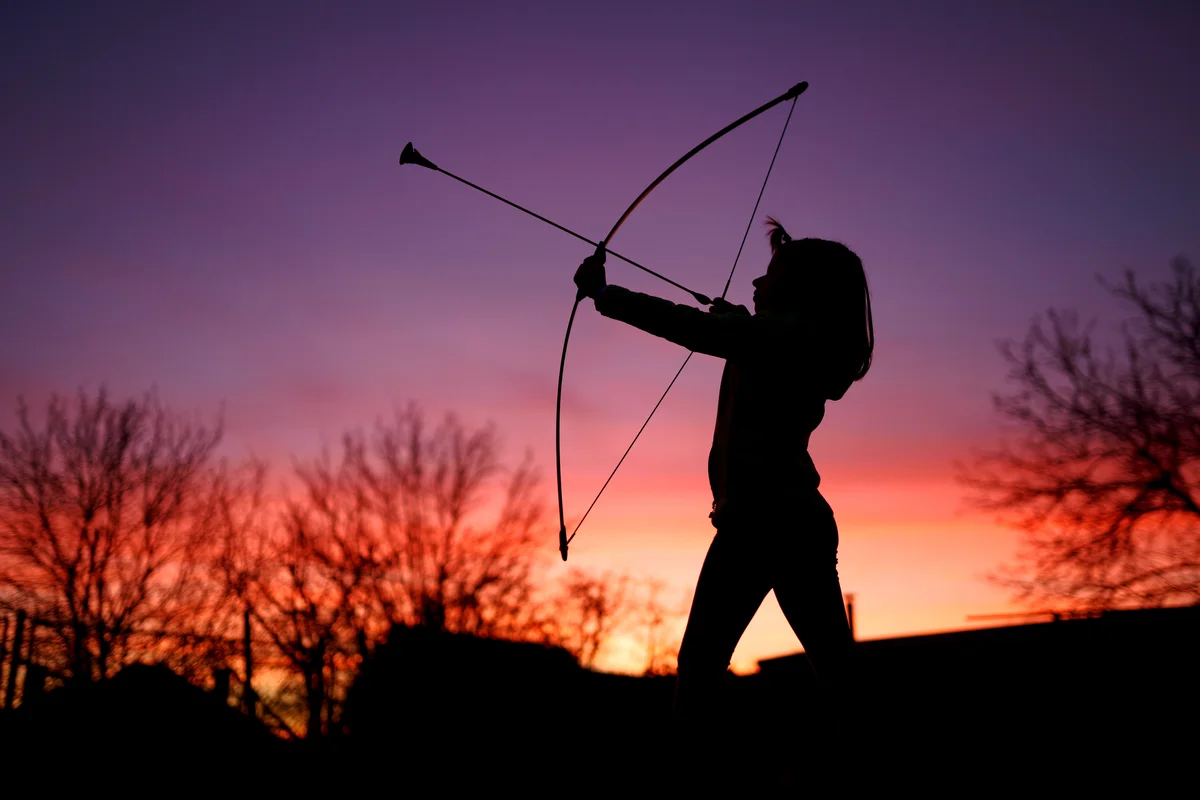 Little archer in sunset