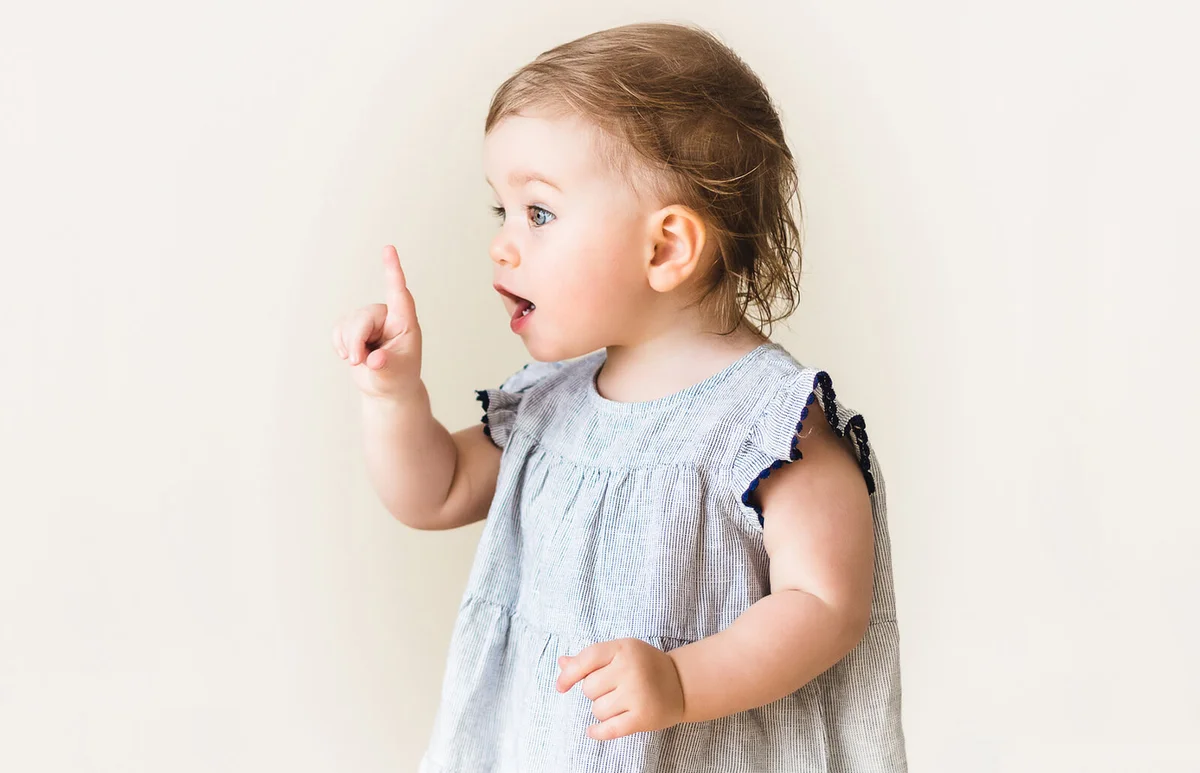Baby girl pointing her finger