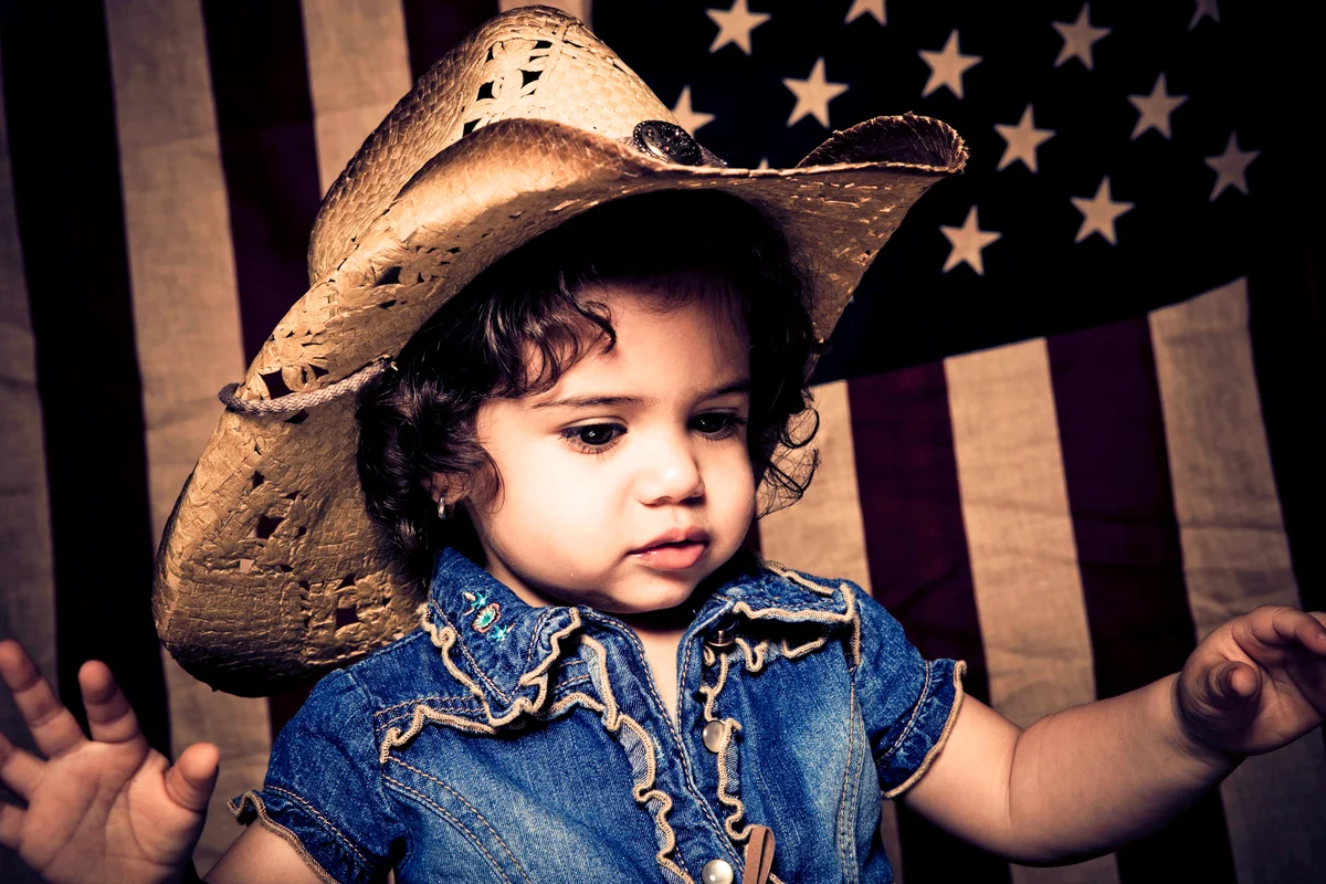 Cute kid wearing cowboy hat