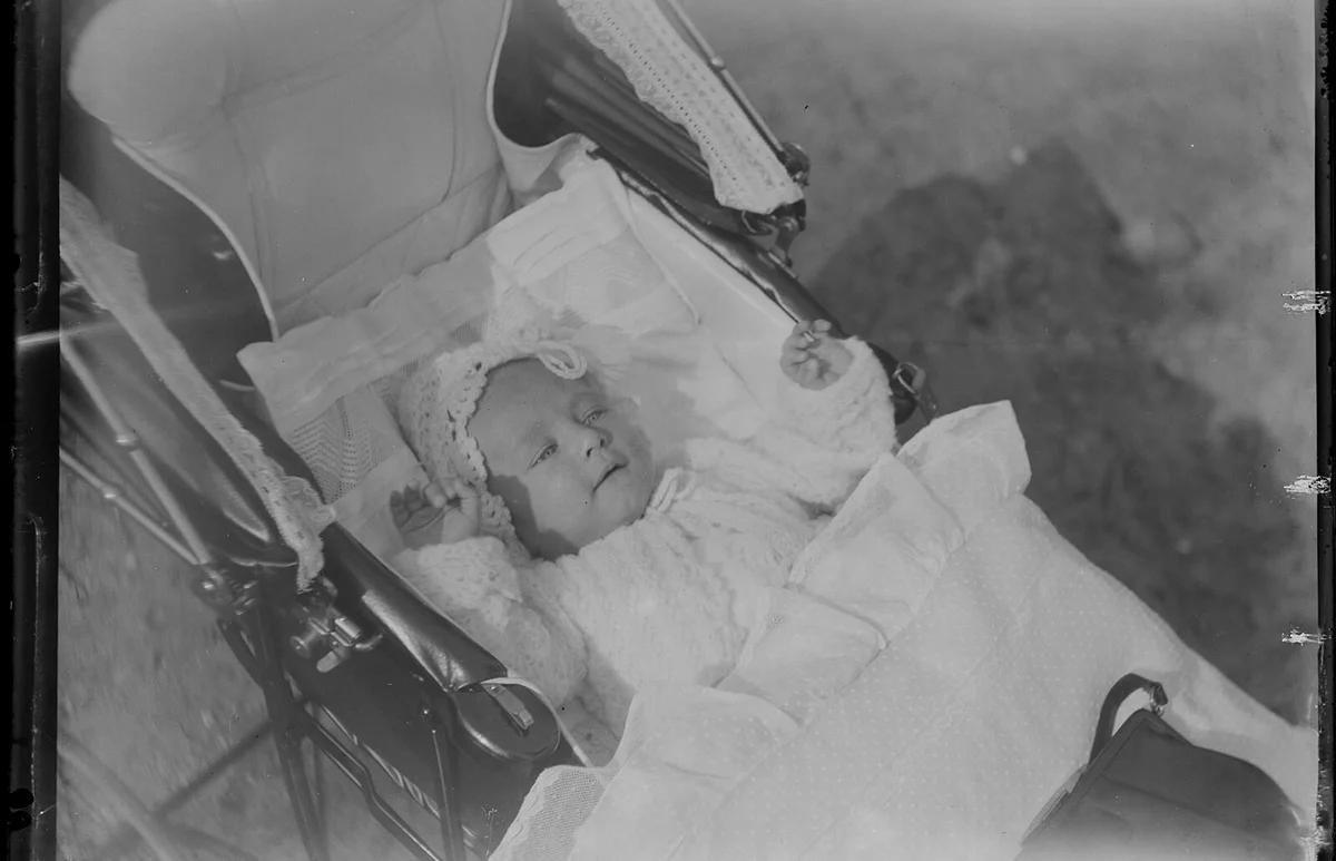 dozing baby in pram