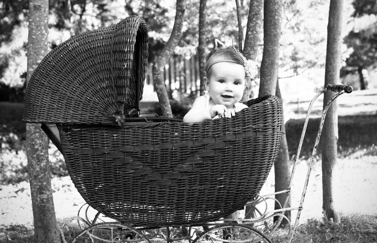 baby girl in an antique pram