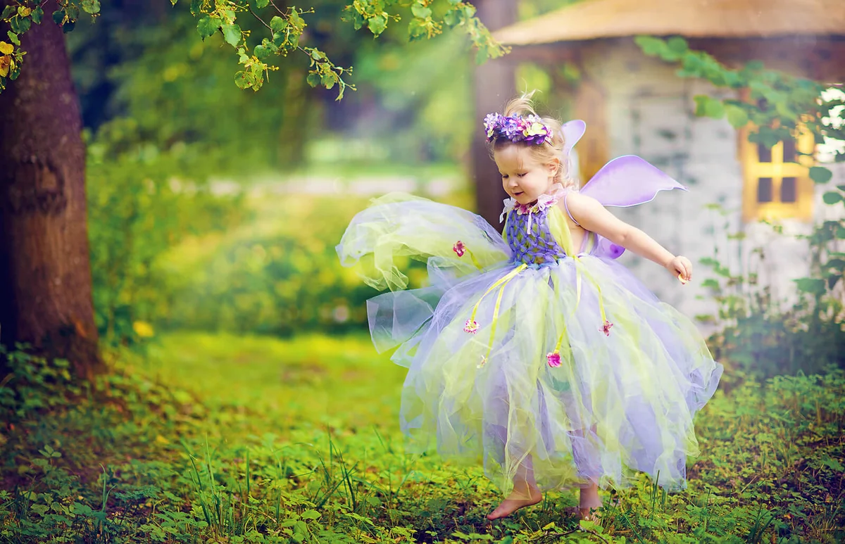 little beautiful elf in the meadow on a sunny summer day
