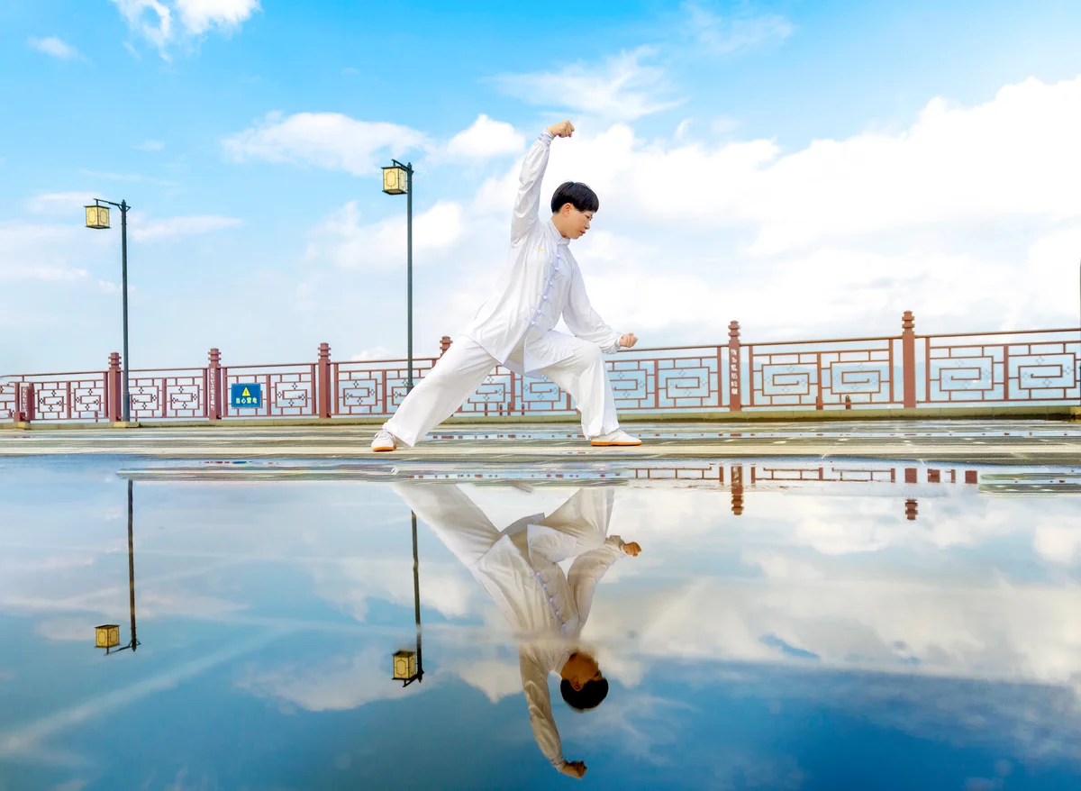 Chinese woman practices tai chi