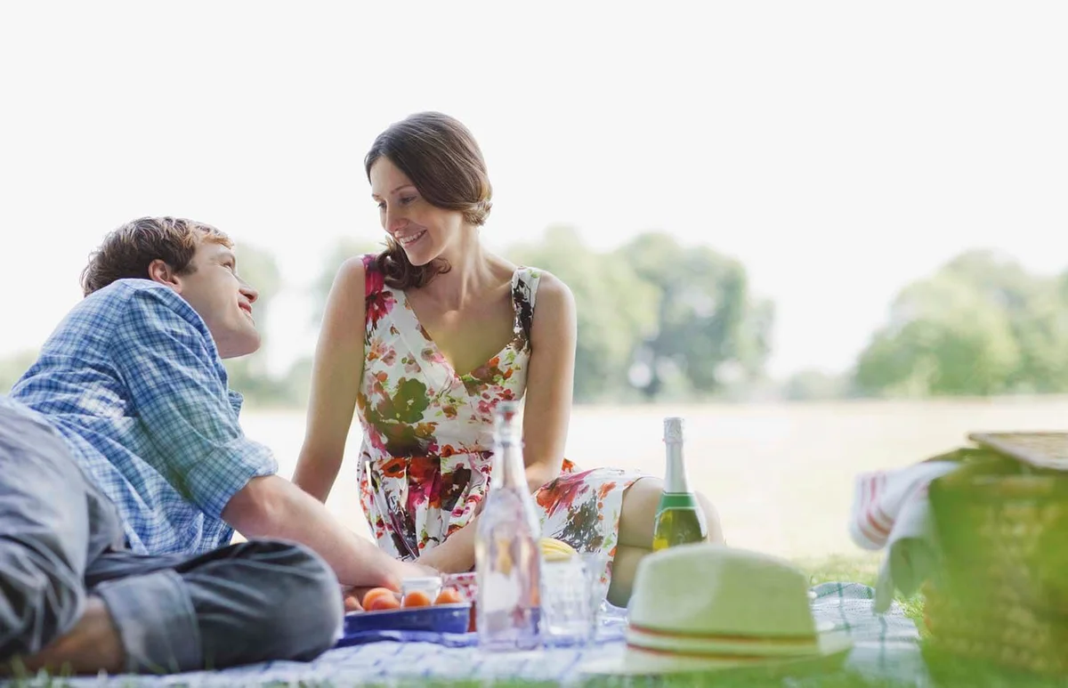 Couple having picnic in park