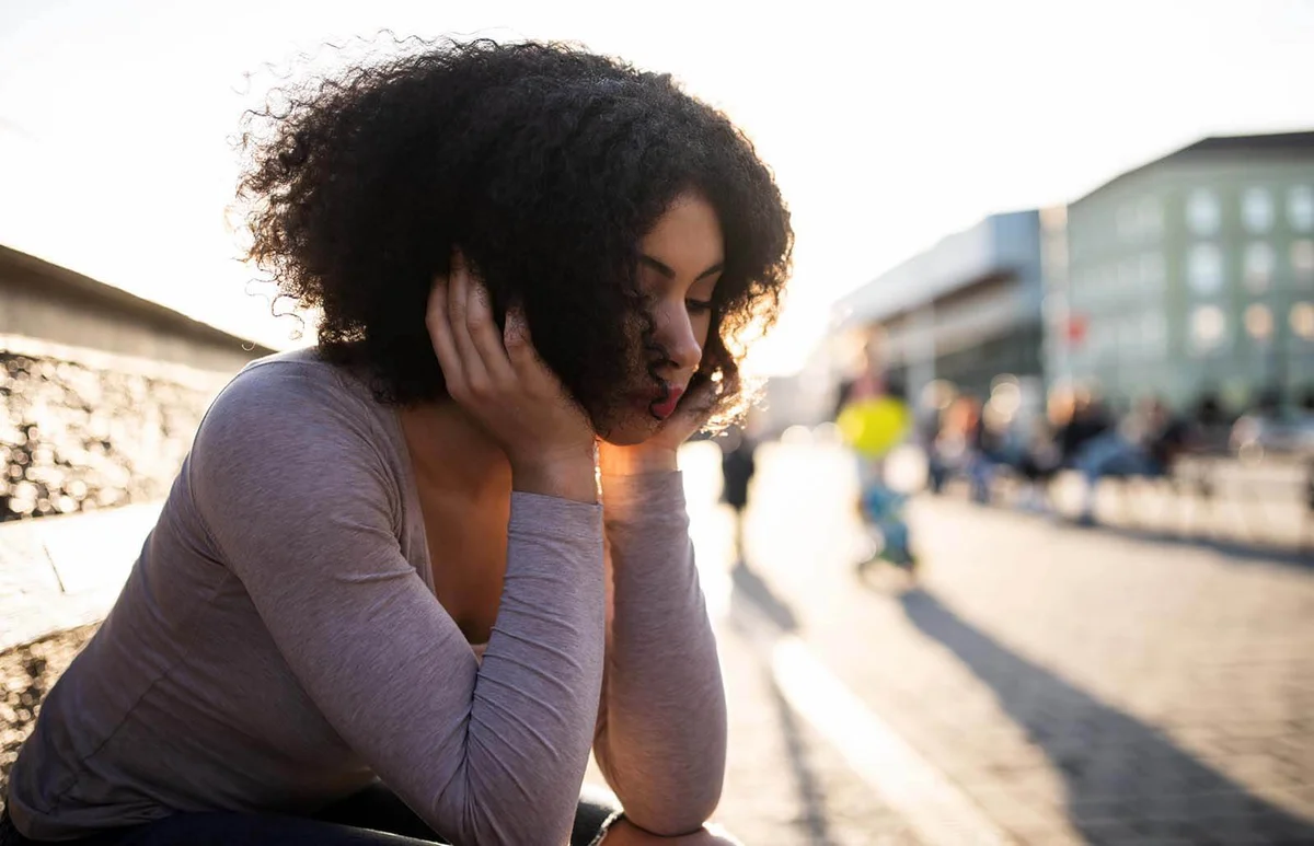 Depressed lonely woman sitting in sorrow