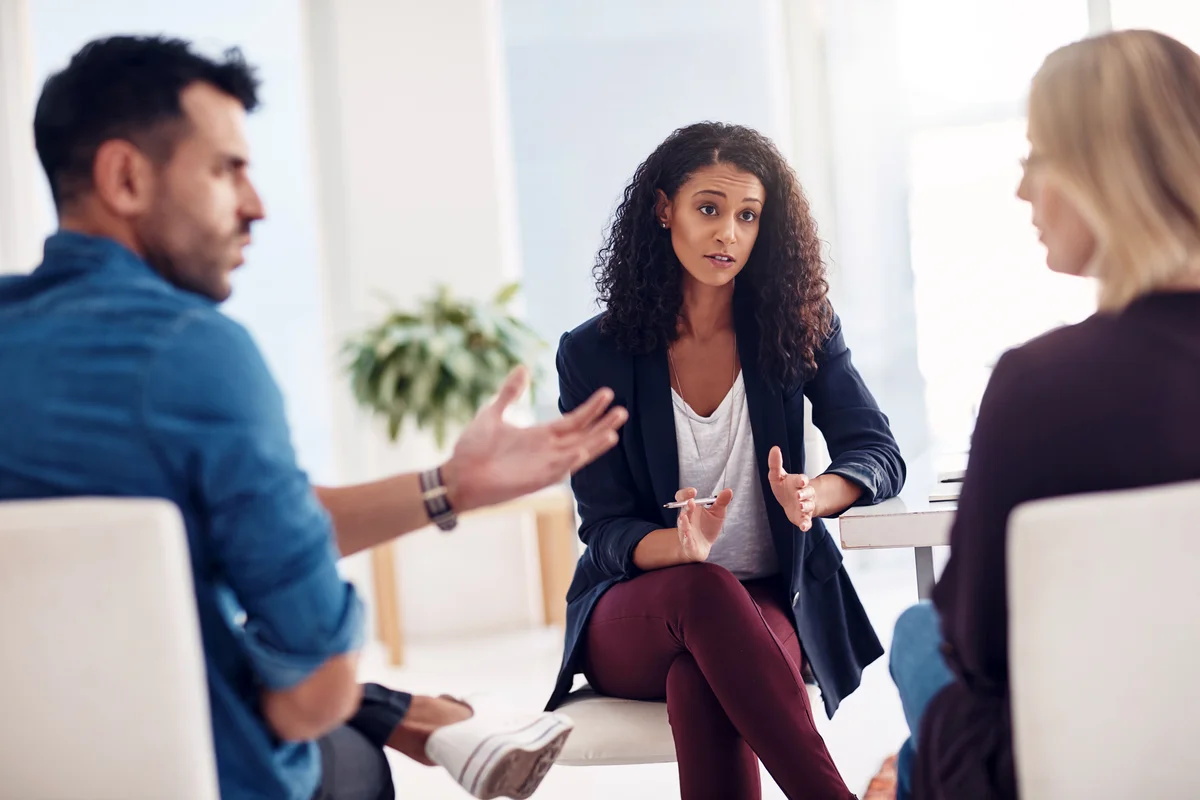 Divorce lawyer talking to a couple