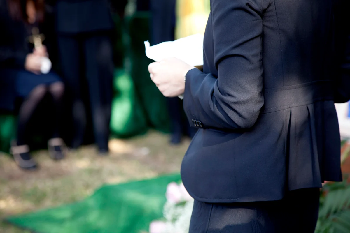 Woman reading eulogy at a funeral
