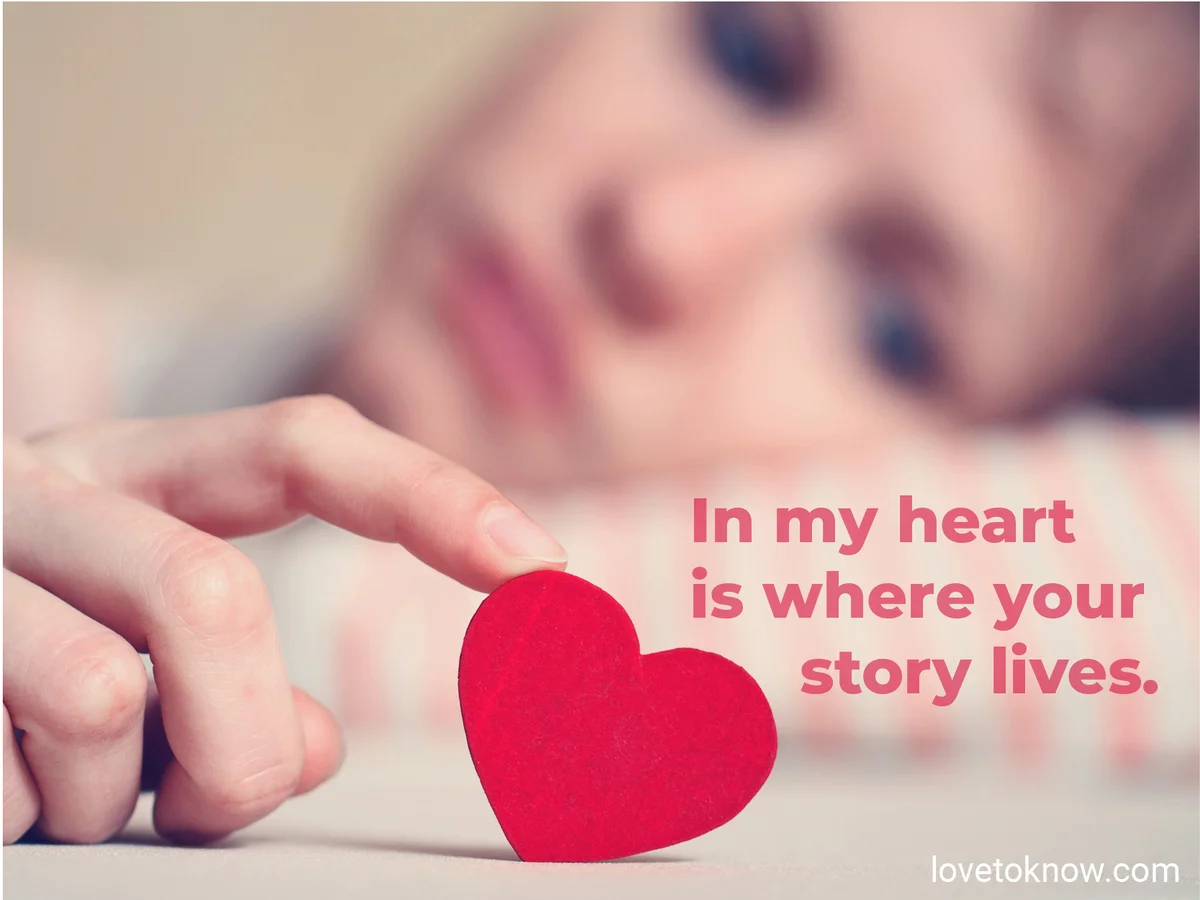 Woman touching little red heart