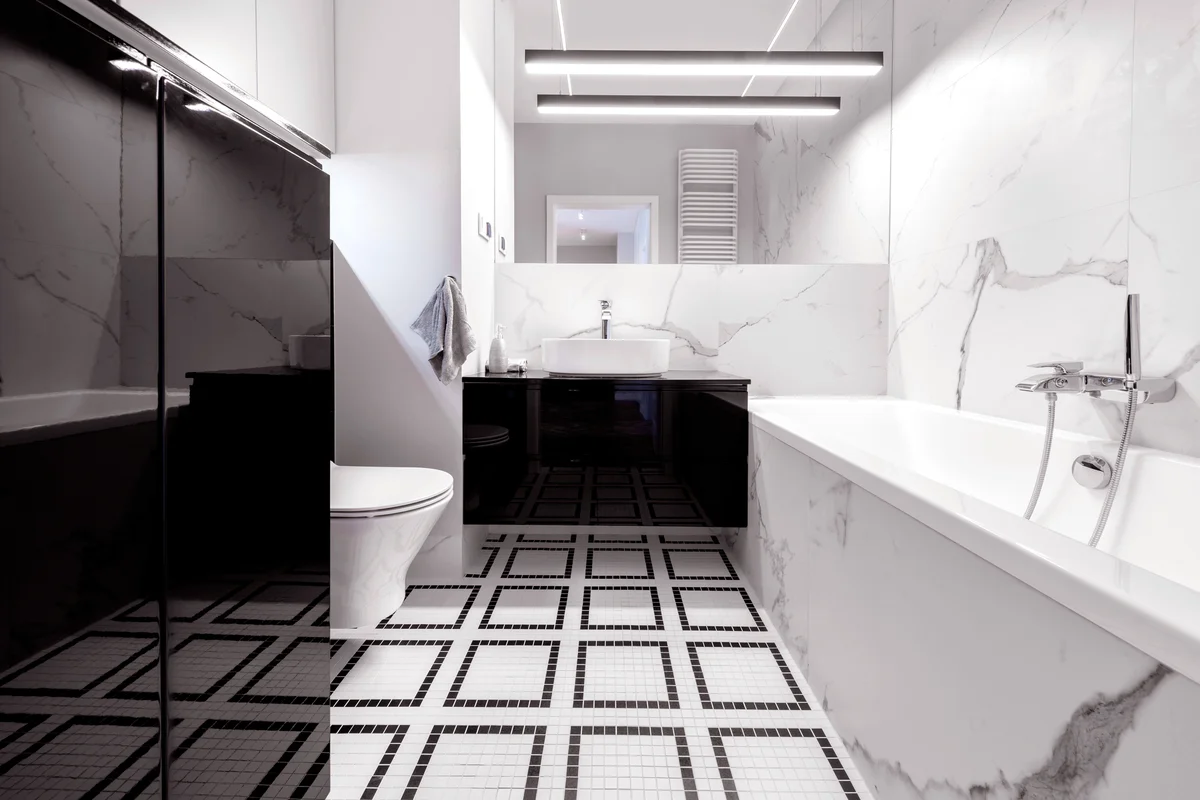 Modern bathroom with marble finishing in black and white style