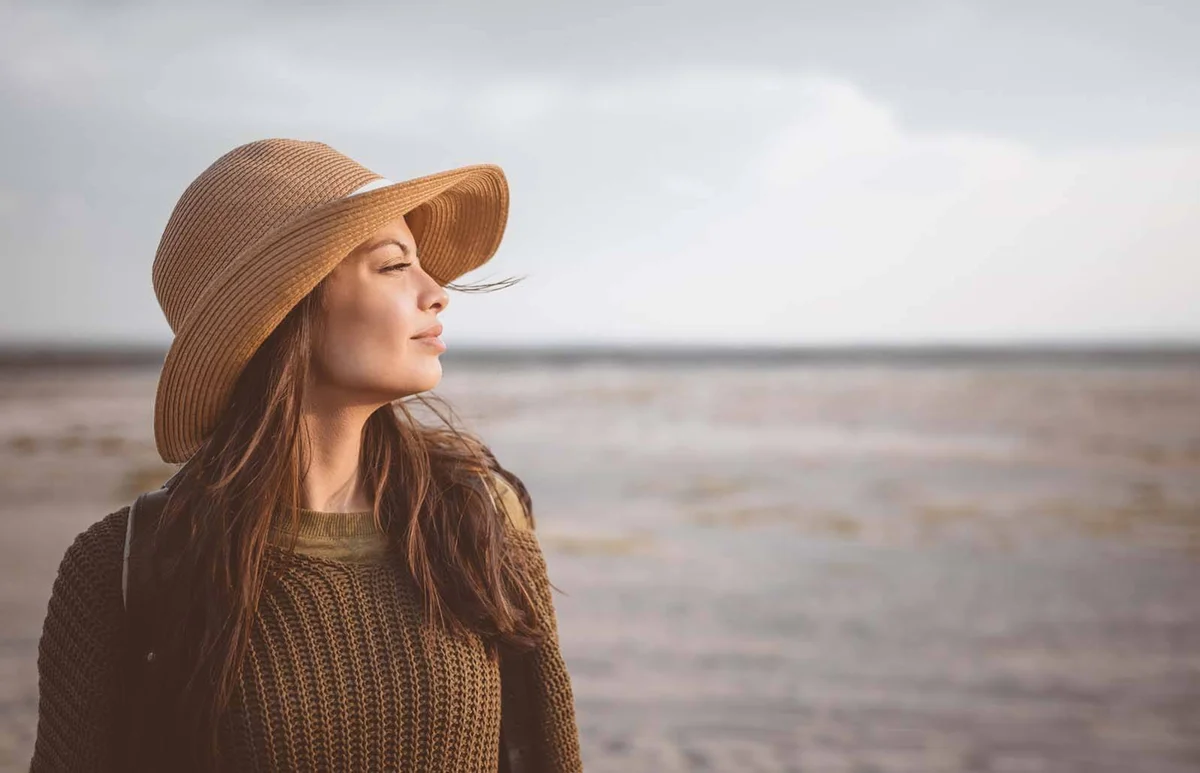 female explorer looking away in desert