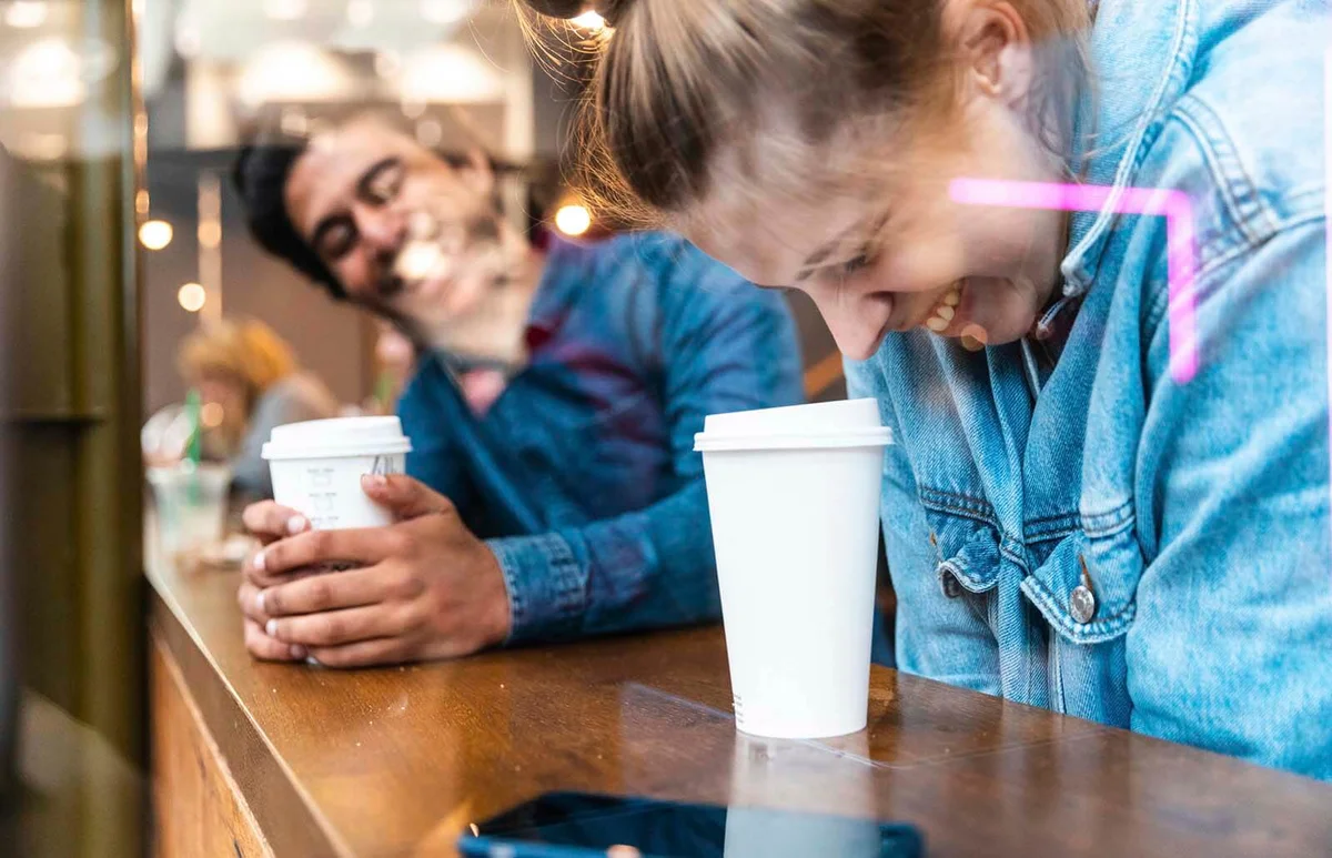 Friends having fun together in a coffee shop