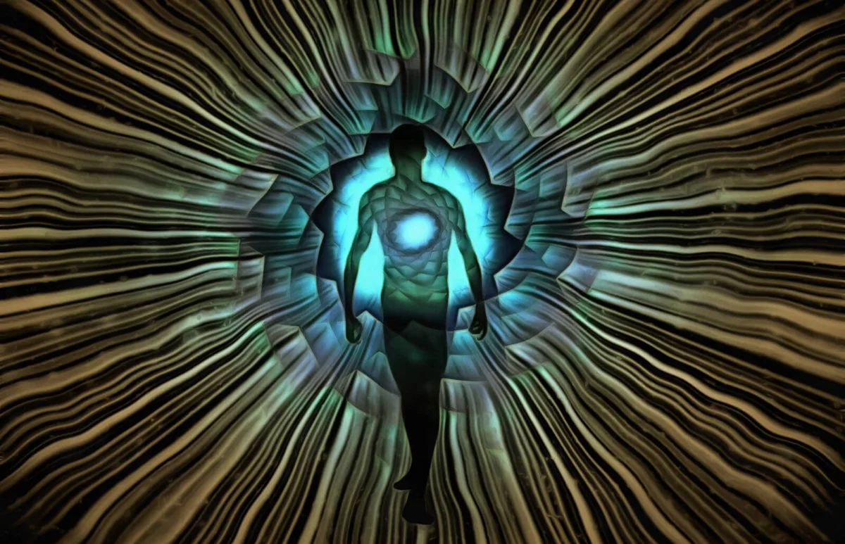 Man's silhouette with rays of light