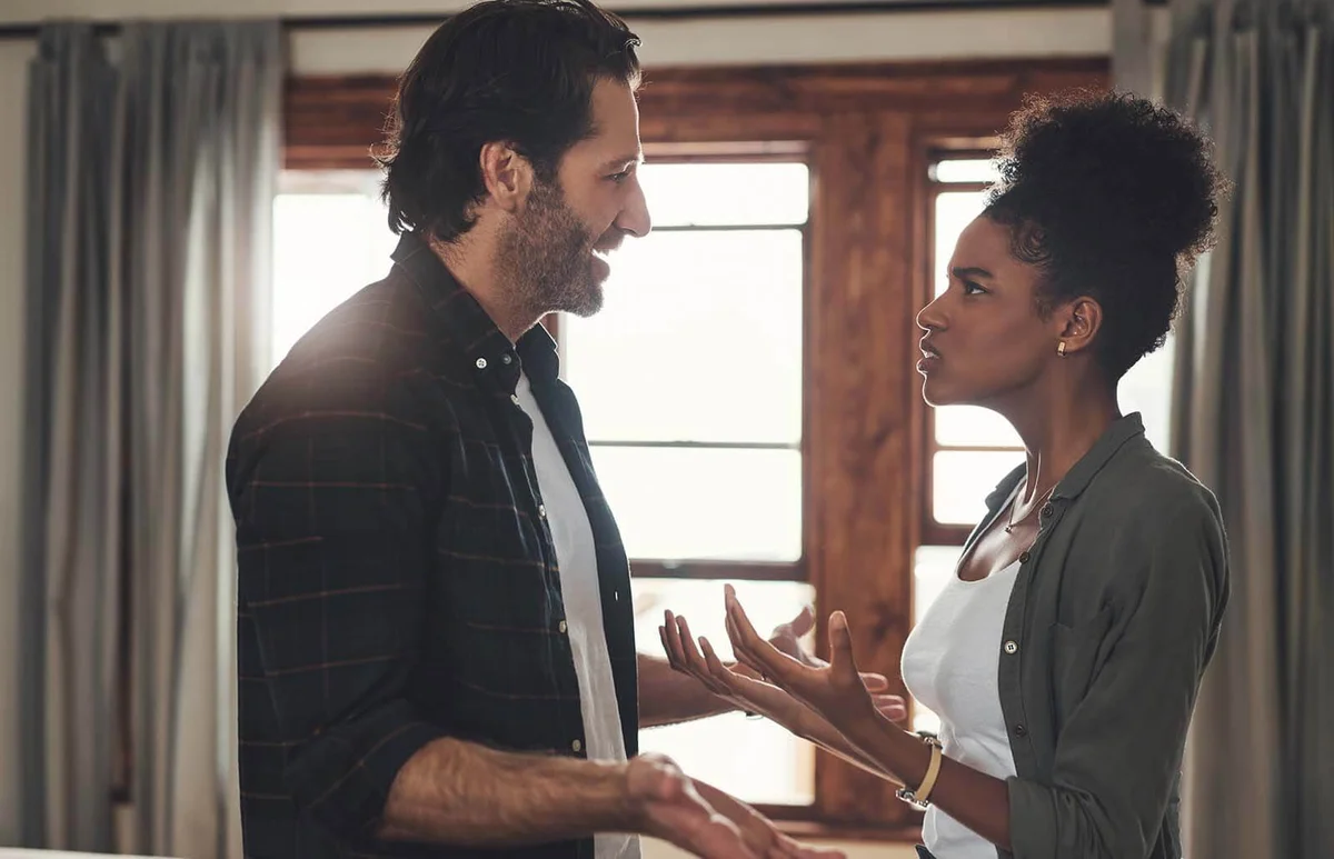 young young couple having an intense argument at home at home