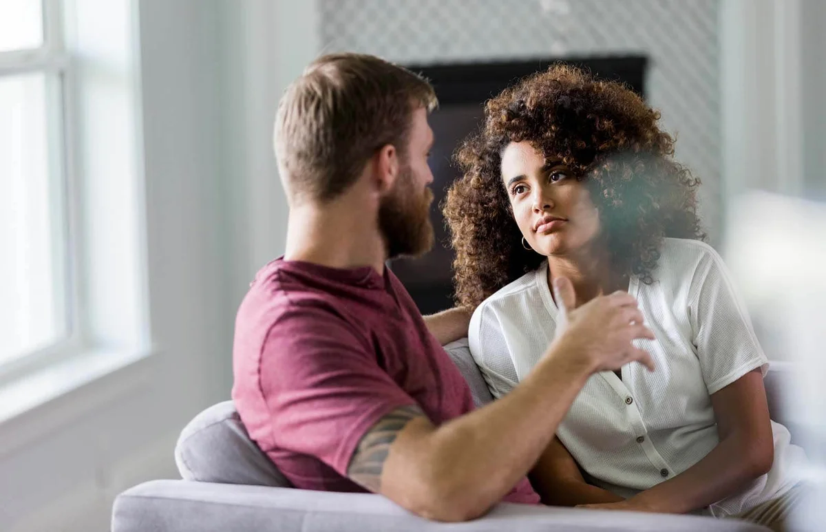 woman listens seriously to husband's ideas