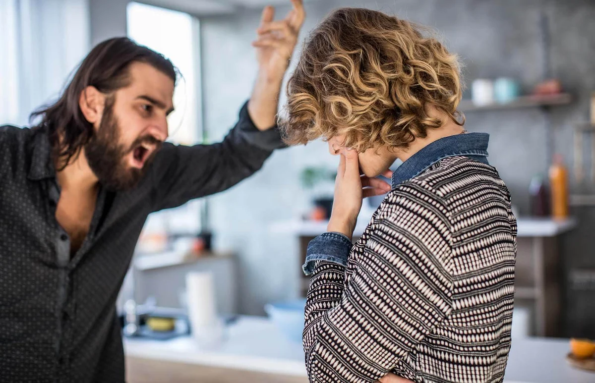married couple arguing at home