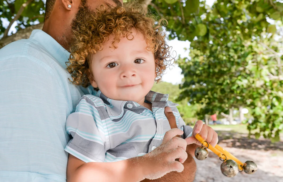 Cute little curly haired mixed race toddler