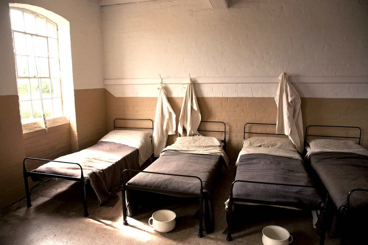 Dormitory in an old English Victorian Workhouse with Chamber Pots
