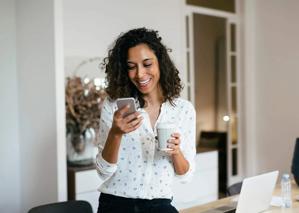 woman in office using smart phone