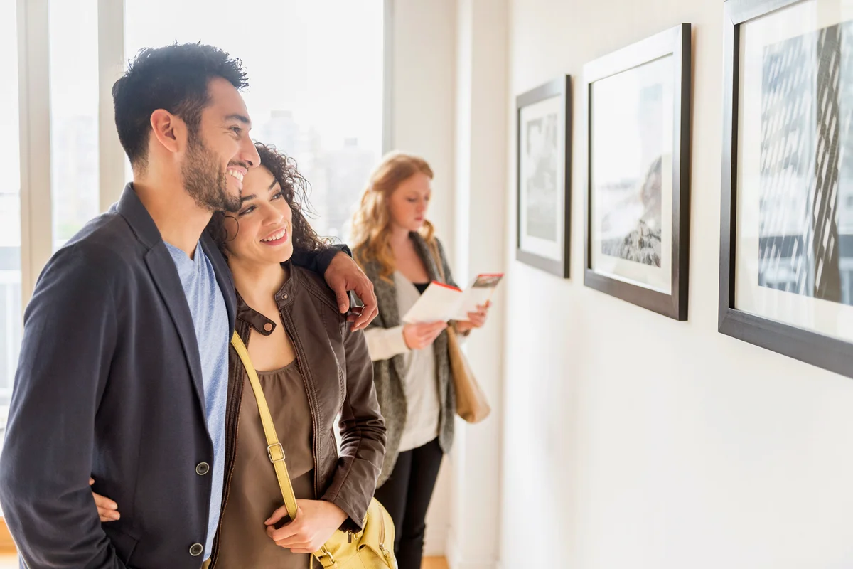 Couple admiring art in gallery