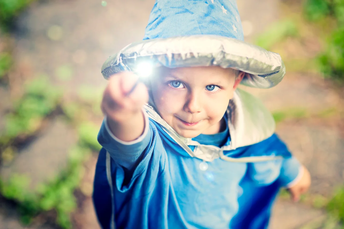 Little wizard casting a spell
