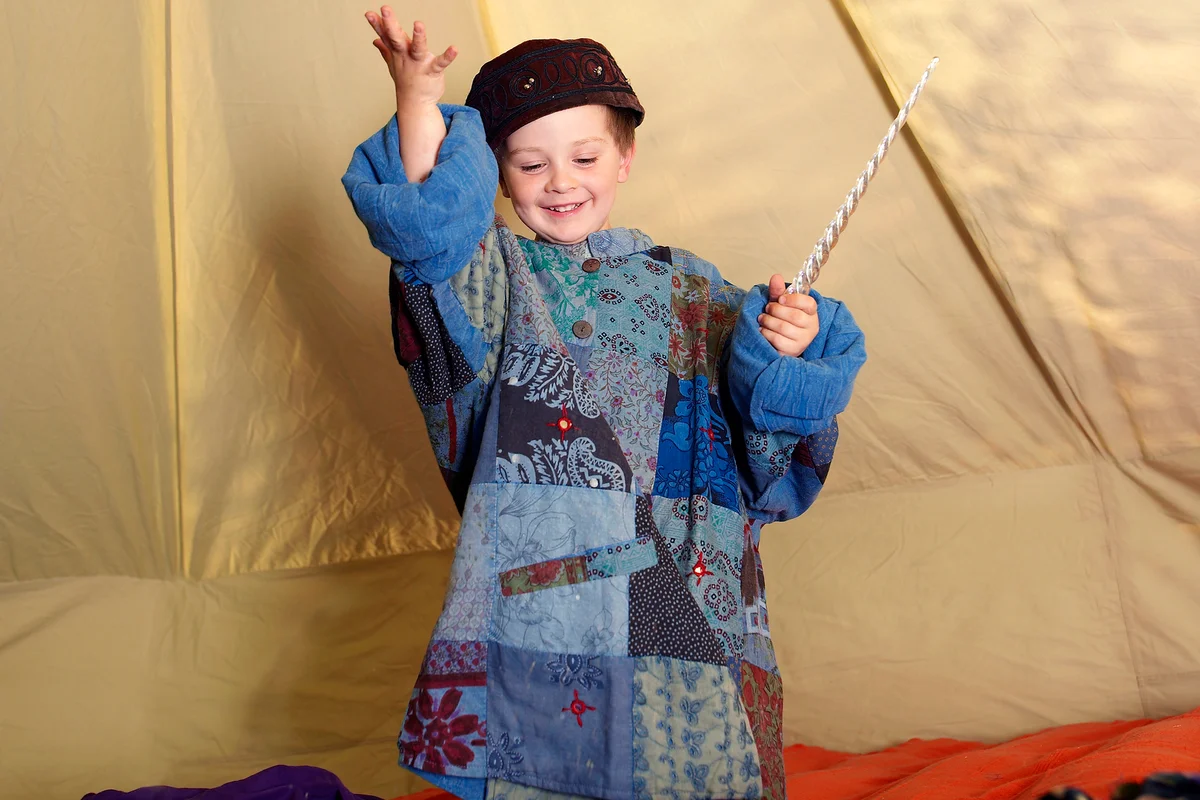 Young boy dressed as a wizard