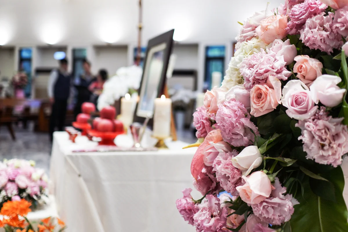Memorial Service with pink flowers in the church