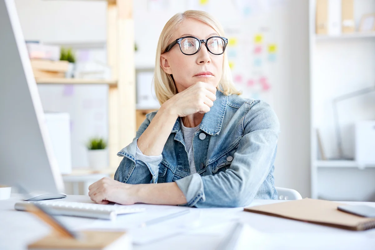 Serious pensive woman working
