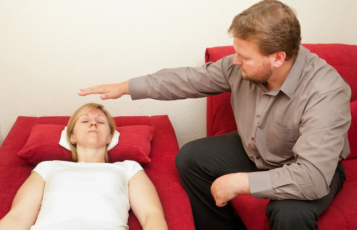 male hypnotist working with a female patient