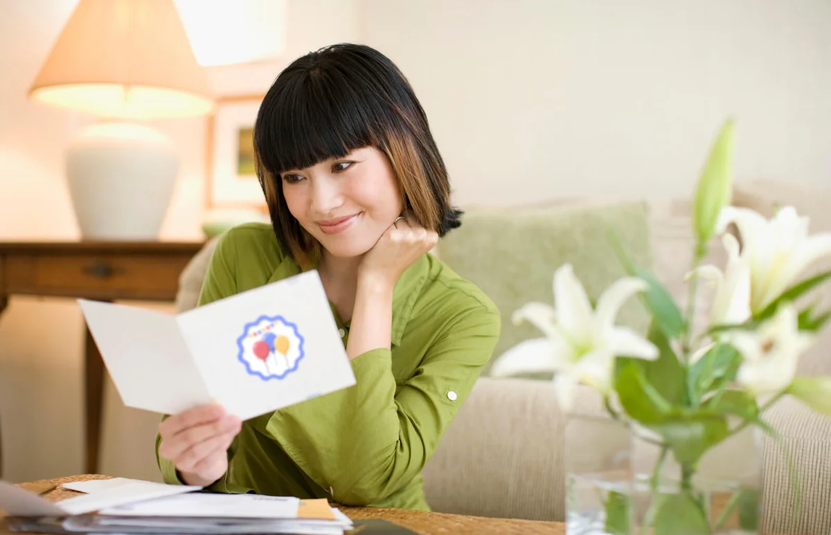 woman looking through mail
