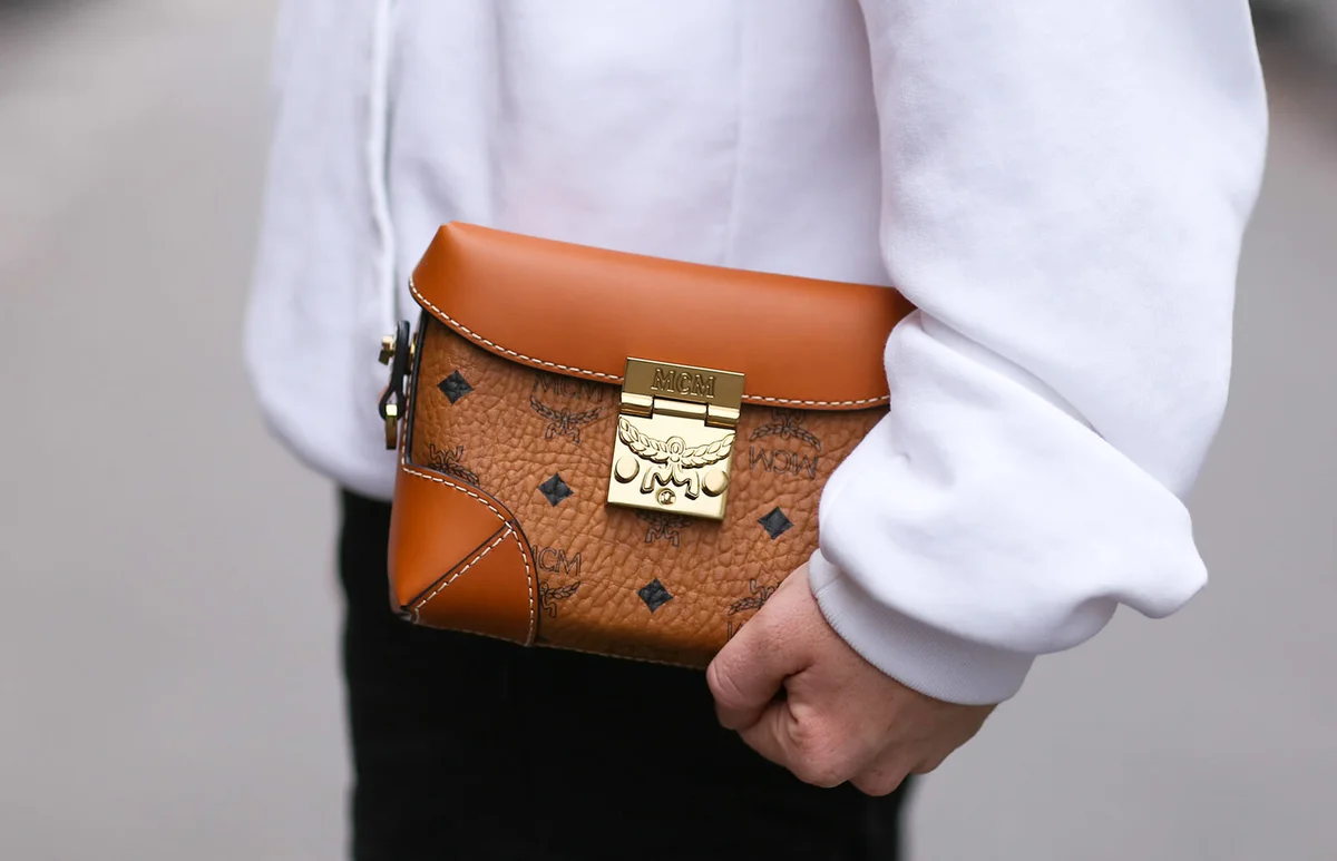 Erik Scholz wearing a Balenciaga hoodie and a MCM bag | Getty Editorial Use