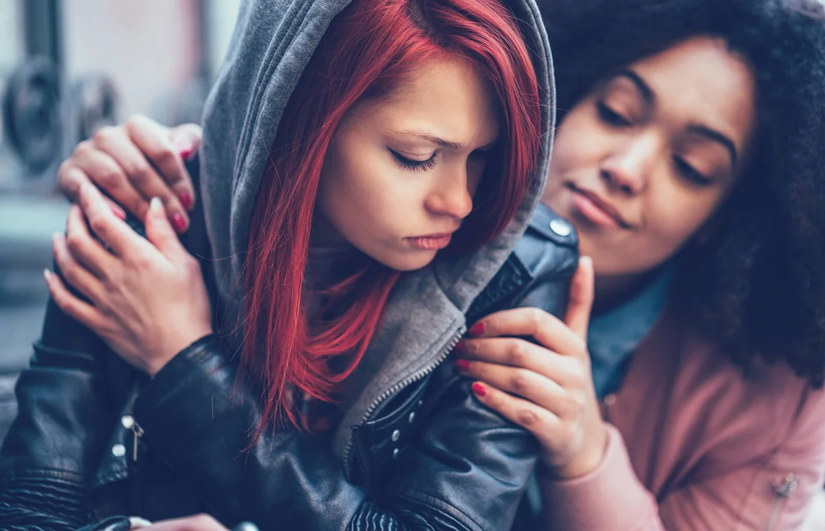 Girl caring about depressed friend