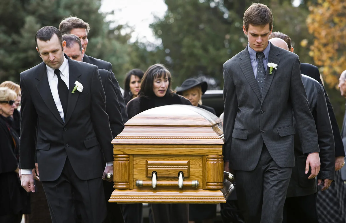 people at a funeral procession