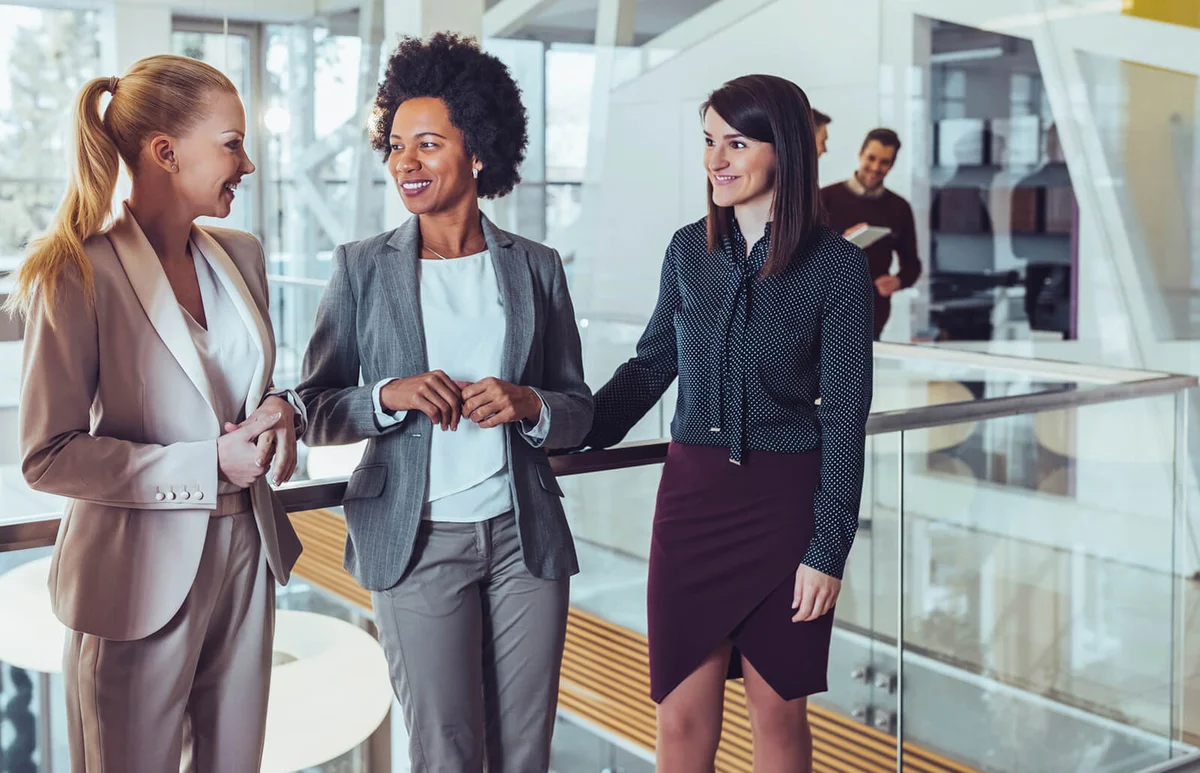 Business women talking to each other during their office break