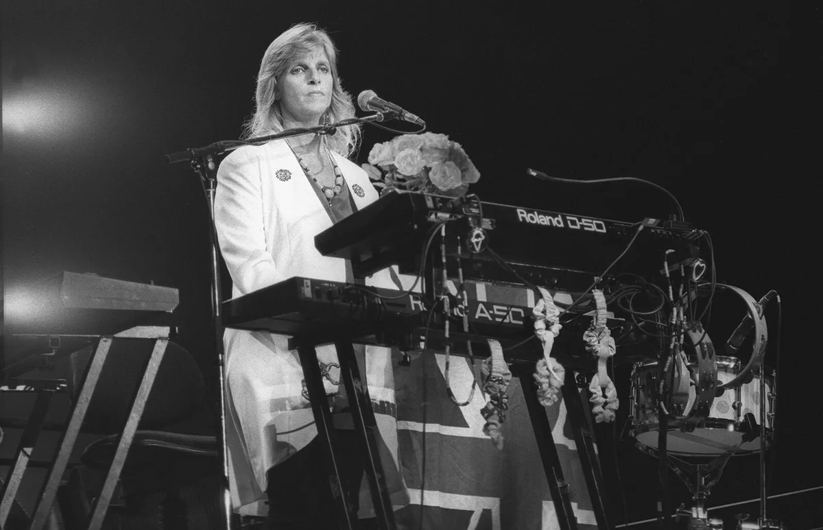 Linda McCartney is shown performing on stage during a "live" concert appearance with the Paul McCartney Band on December 12, 1989 | Getty Editorial Use