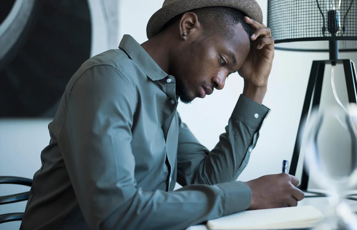Young man working on a worksheet