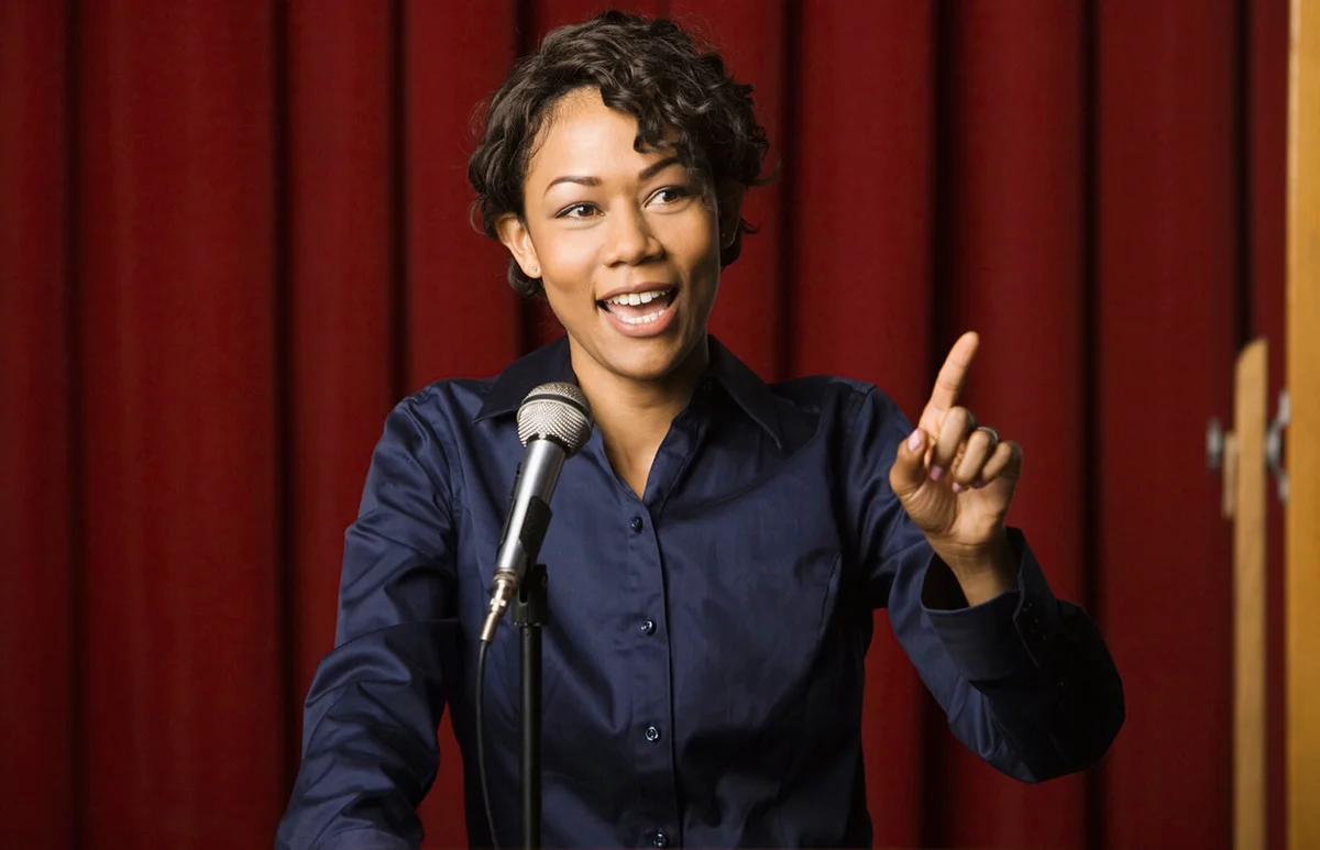 businesswoman speaking at podium