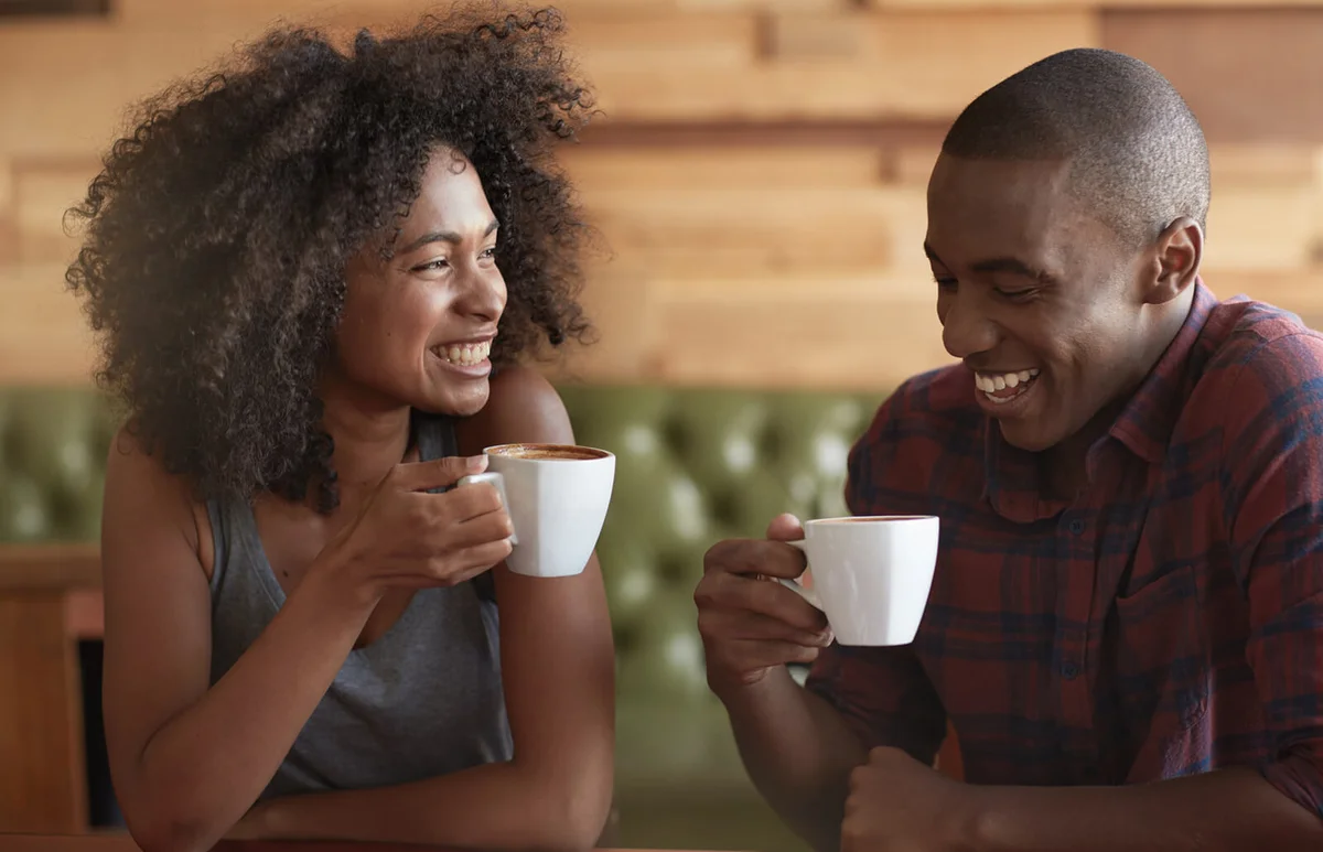 young couple sitting in a coffee shop