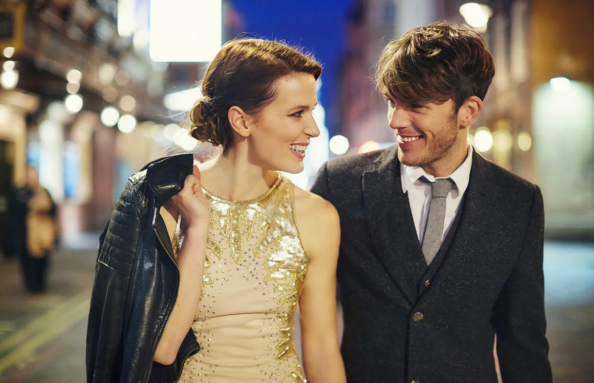 Couple on street at night