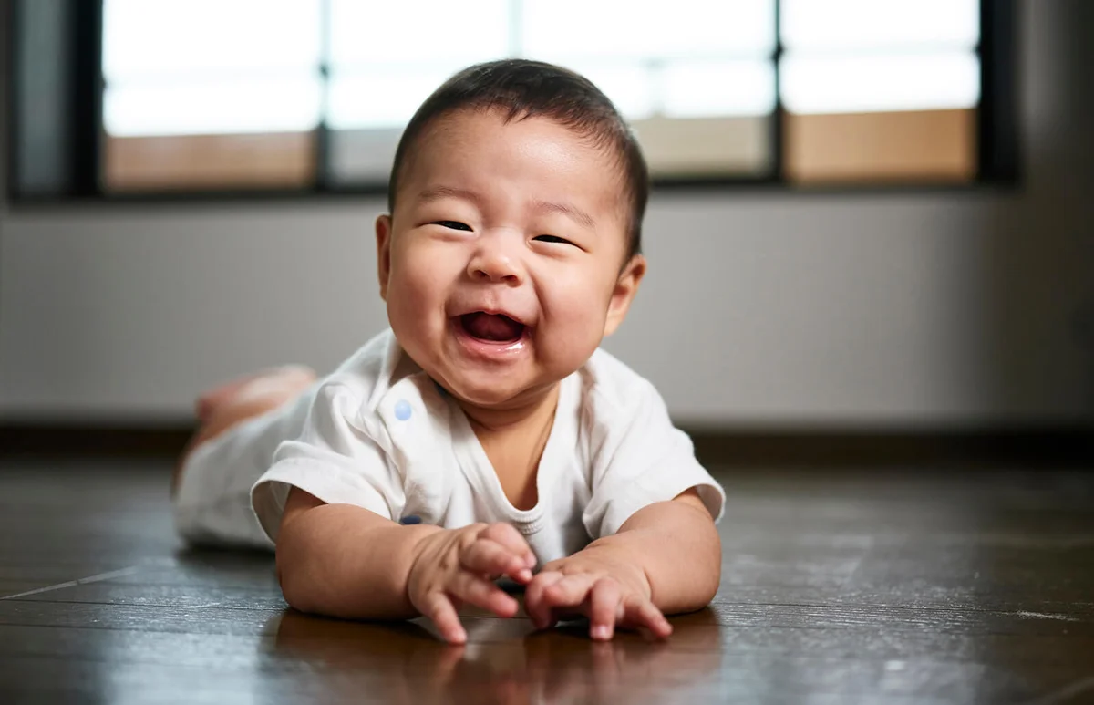 A six month old Japanese baby boy inside a home