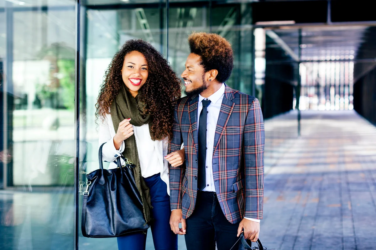 Well dressed couple smiling