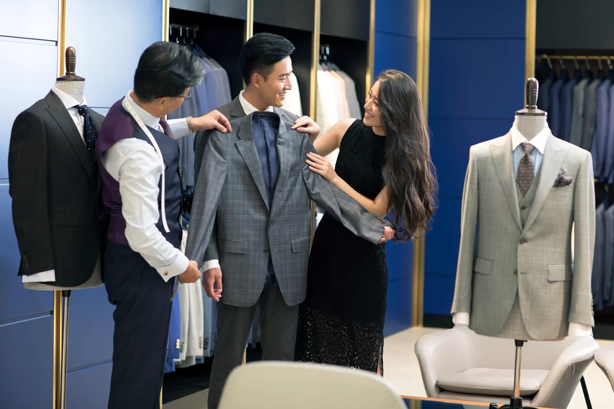 Young couple shopping in a men's wear store